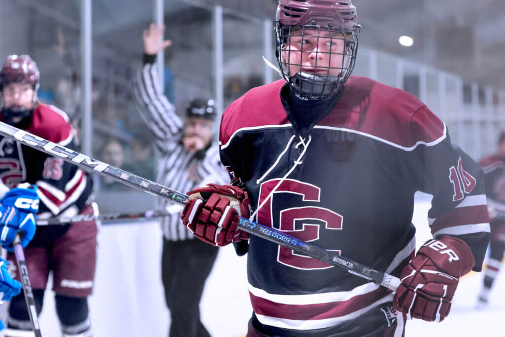Owen Moynihan receives a five-minute penalty after a hit on an Acton-Boxborough defenseman. Photo by Leslie Bailey