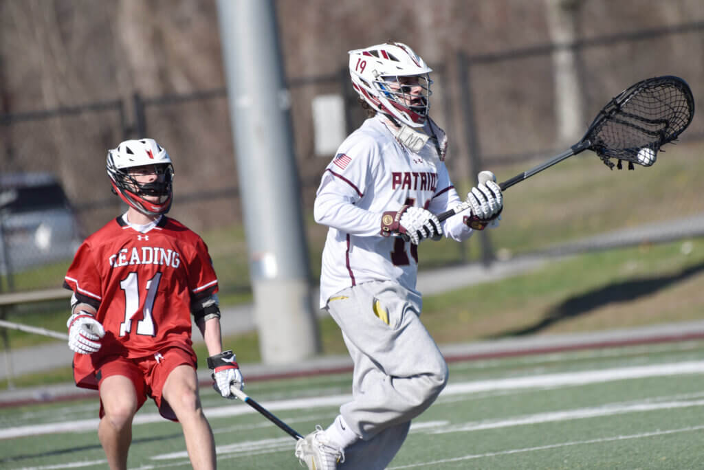 Goalie Henry Morgan takes the ball down the field. Photo by Cris Van Dyke