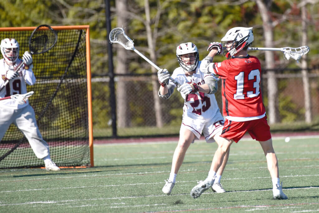 Chris Sim defends as Henry Morgan is ready in the goal. Photo by Cris Van Dyke