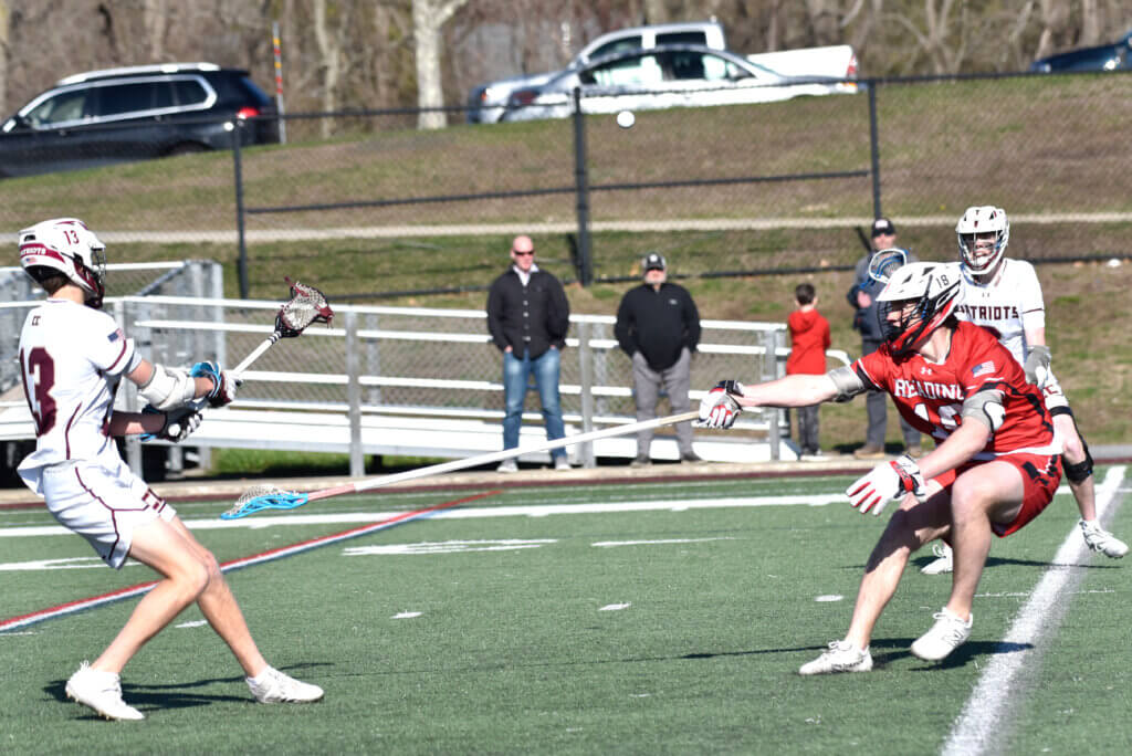 Jason Swaim passes to Tyler Shepard. Photo by Cris Van Dyke