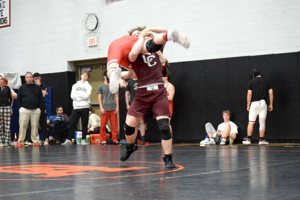 Jonathan Lucas about to mat return his opponent from Hingham. Photo by Kim Amouzgar
