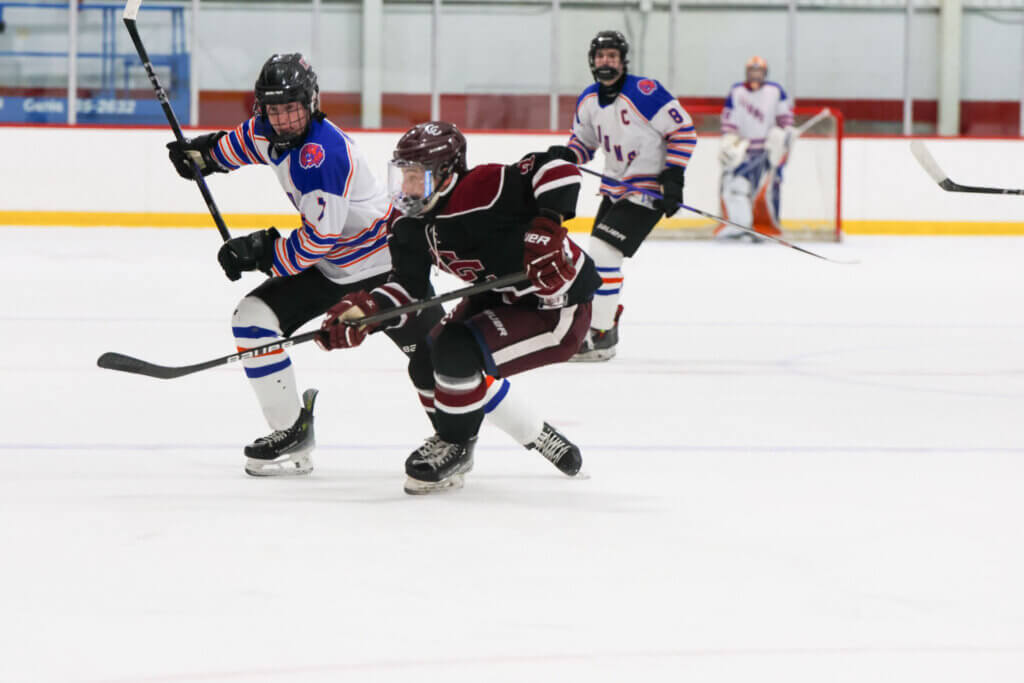 Chris Bono forces an attacker to the outside. Photo by Leslie Bailey
