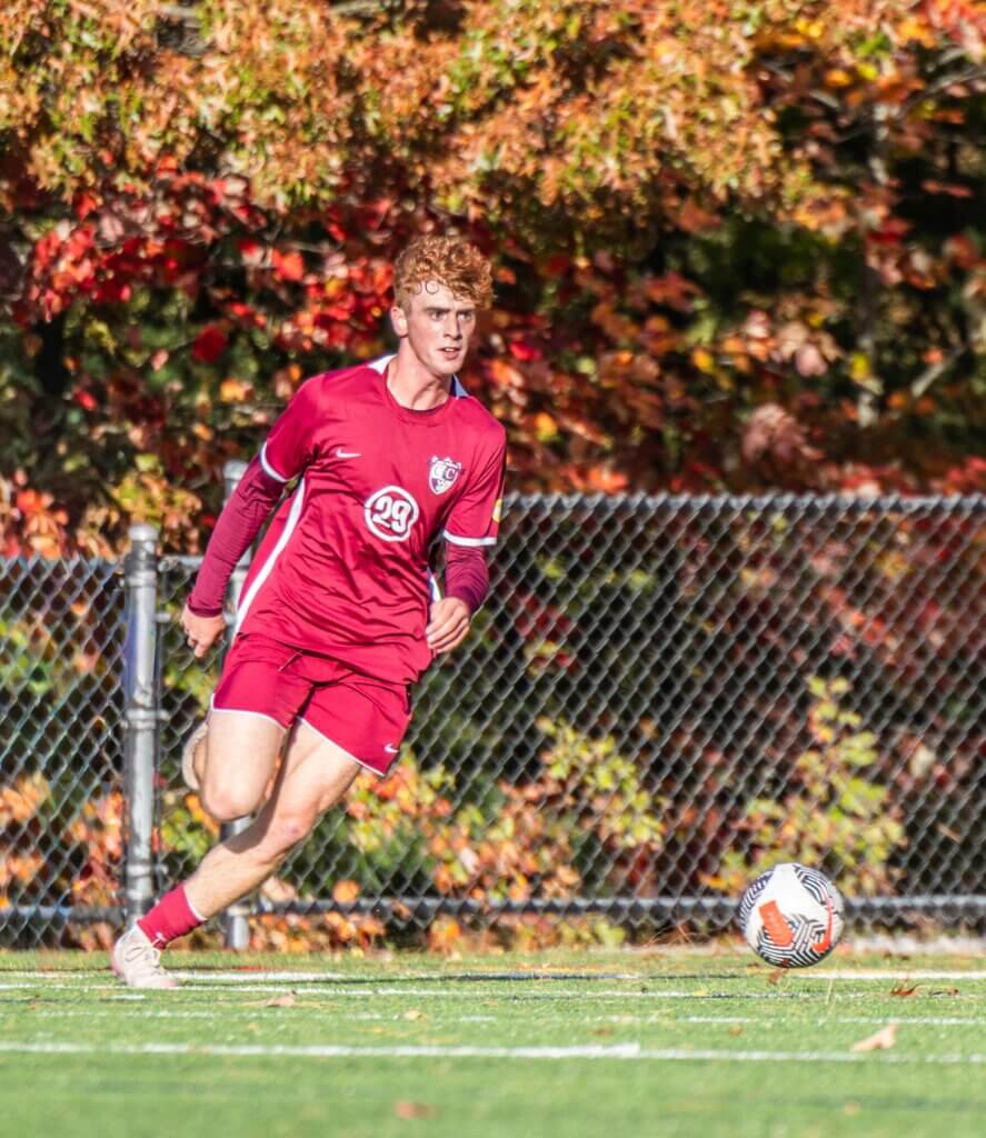 Joe Ferrari looks for an opening against Westford Academy on October 16. Photo by Rebecca Woodward