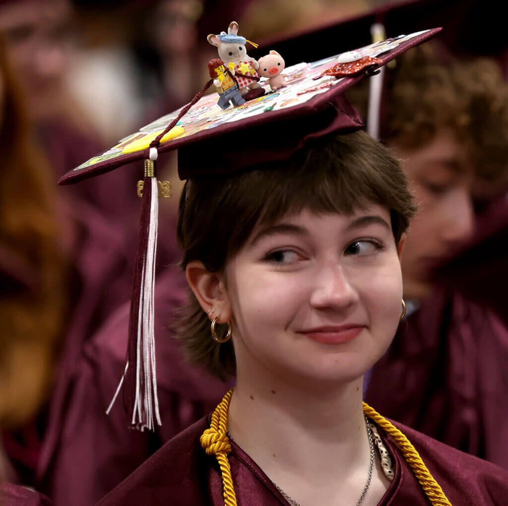 Claire Roeser decorated her mortarboard with whimsical figurines.