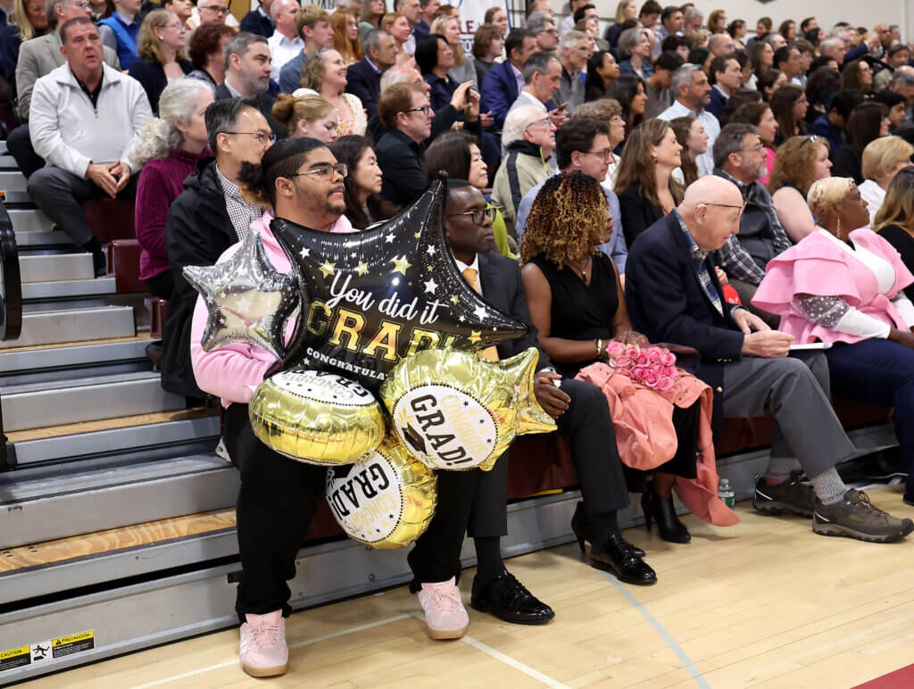 Josh Breneus had a bunch of congratulatory balloons ready for his cousins, twins Alexia and Alivia Breneus.