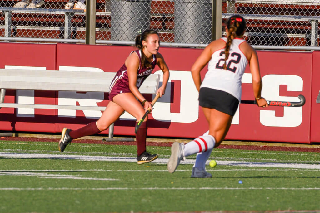 The Patriots’ Ceci Clancy drives into Wellesley territory in their clash on September 22. Photo by David Clancy