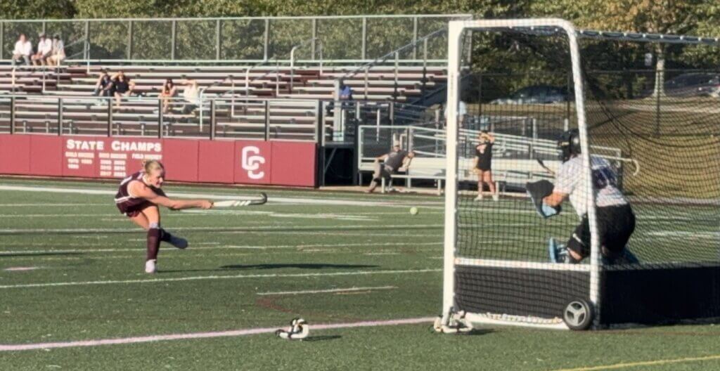Abby Ruhmann scores on a penalty stroke. Photo by David Clancy