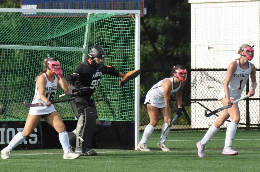 Ally Couto, goalie Lexie Ramirez, Maddie Clancy, and Abby Ruhmann stifle a corner. Photo by David Clancy