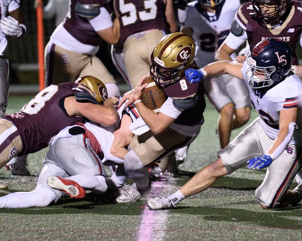 Wes Morse scores his second touchdown of the game with help from Owen Root (No. 68). Photo by Jon Straggas