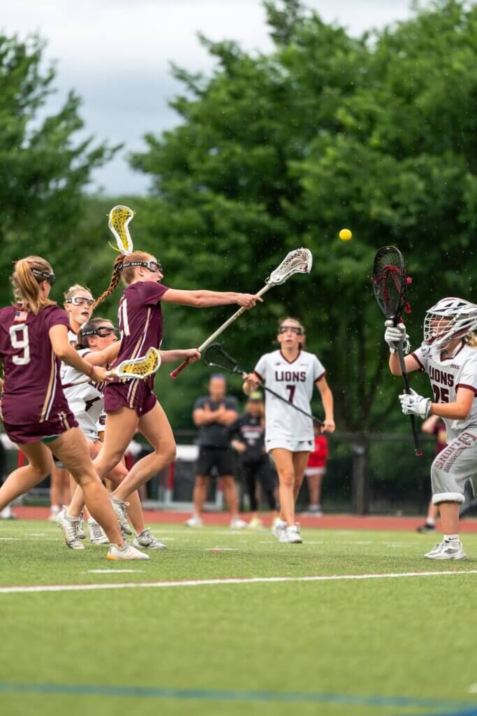 Acton-Carlisle sophomore Julia Reynolds (left) takes a shot on goal. Photos by Aidan Moroney