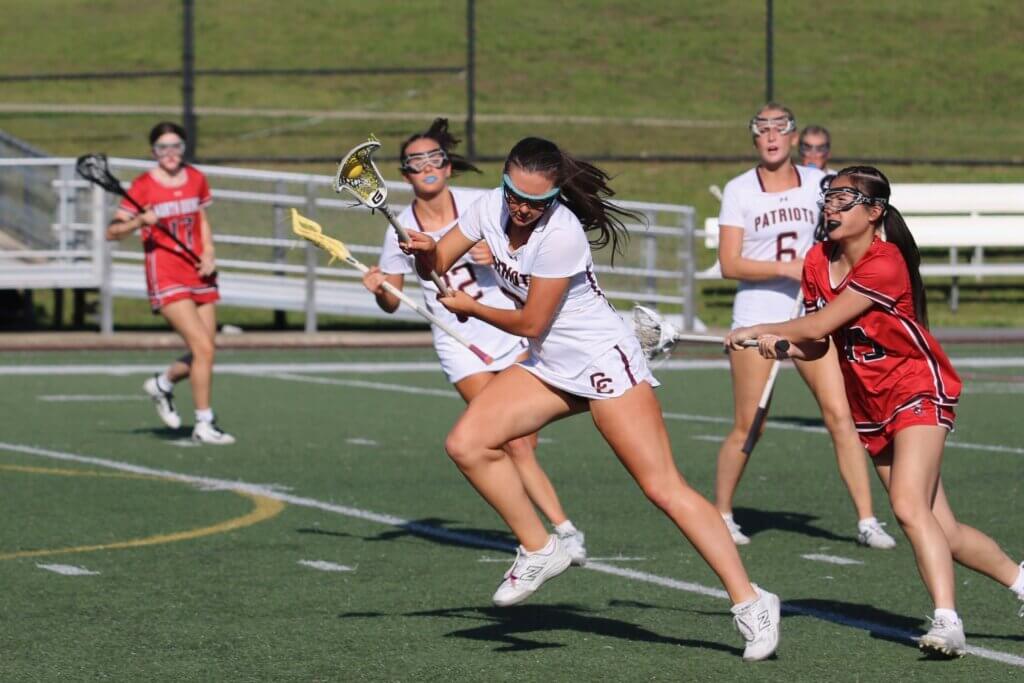 CCHS’ Grace Holsinger battles through midfield en route to a successful clear. Photo by Bob Little 
