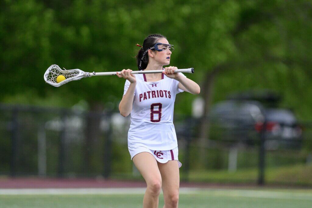 Senior co-captain Hannah Feloney (No. 8) looks for an open CCHS teammate. Photo by Jon Straggas 