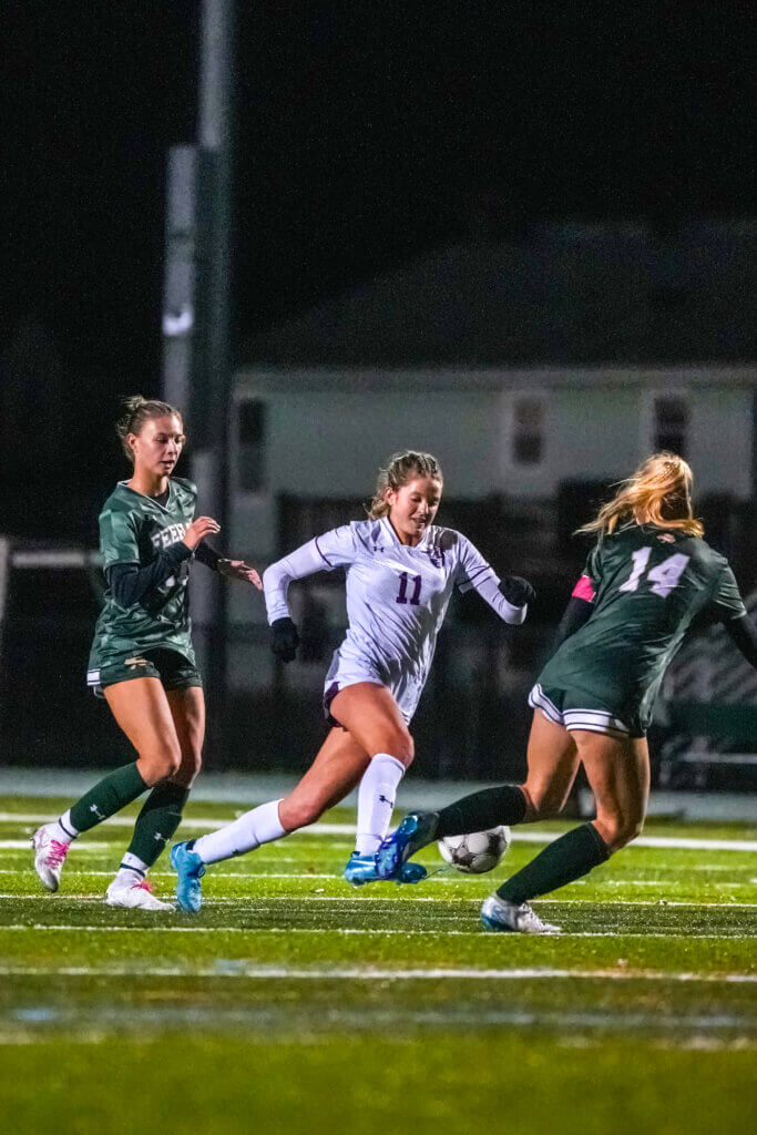 Emmy O'Donnell (No. 11) charges upfield. Photo by Aidan Moroney