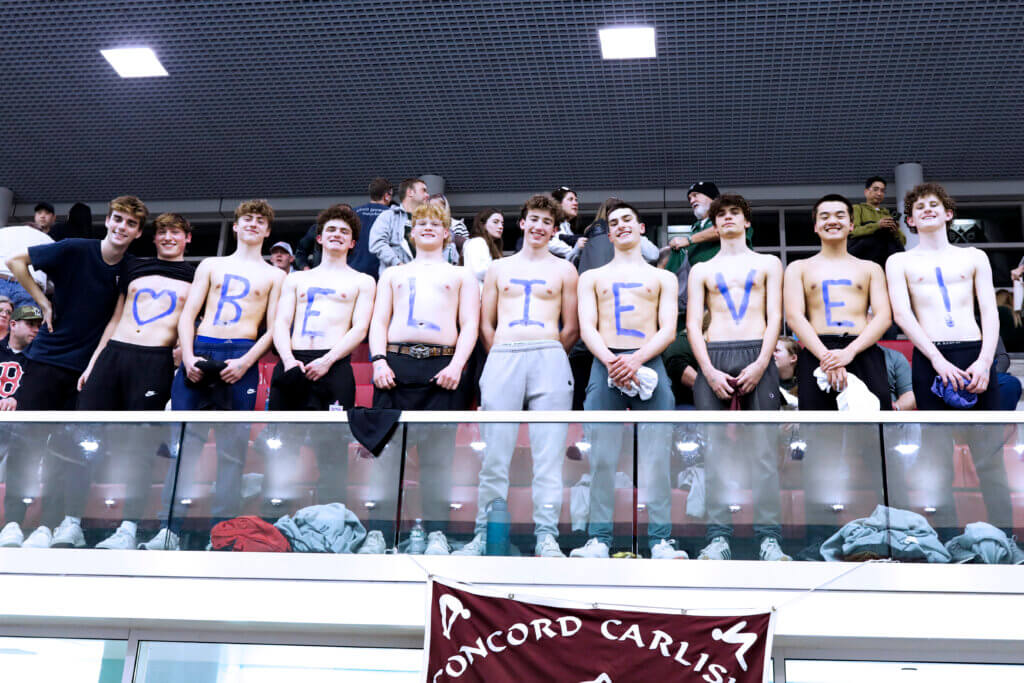 The CC boys team cheers on the girls. Photo by Kate Renyi
