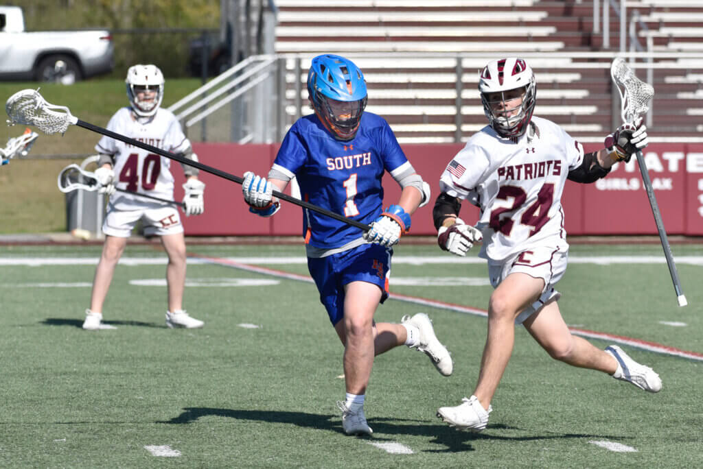 Sawyer Carnes keeps the ball away from an opponent.