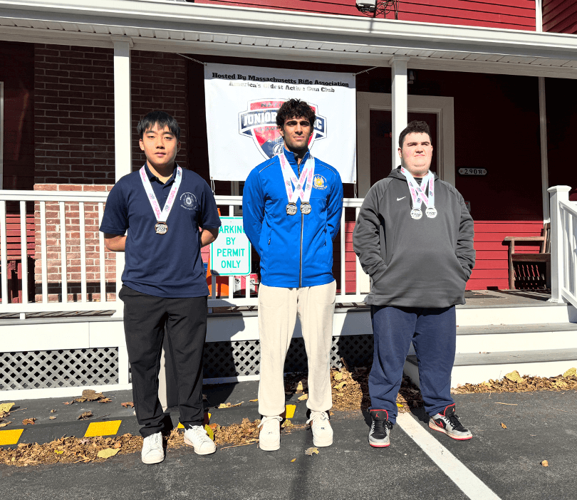 Ammar Bagasra, center, a Acton-Carlisle High School senior, earned two gold medals at the 2025-26 USA Shooting Massachusetts State Junior Olympic Qualifiers, becoming Massachusetts junior champion. Ammar captured gold in the Men’s Air Pistol and the Men’s Sport Pistol events last weekend at the Massachusetts Rifle Association in Woburn. This achievement qualifies Ammar for the USA Shooting Junior Olympics. Also pictured are silver medalist Dylan Chadsey, right, and bronze medalist Daniel Choi. Courtesy photo