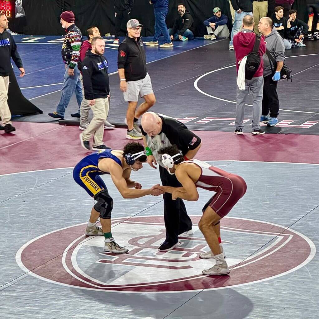 CCS's Ammar Bagasra, right, won by pin soon after the handshake at the Lowell Holiday Tournament. Photo by Drum Bell