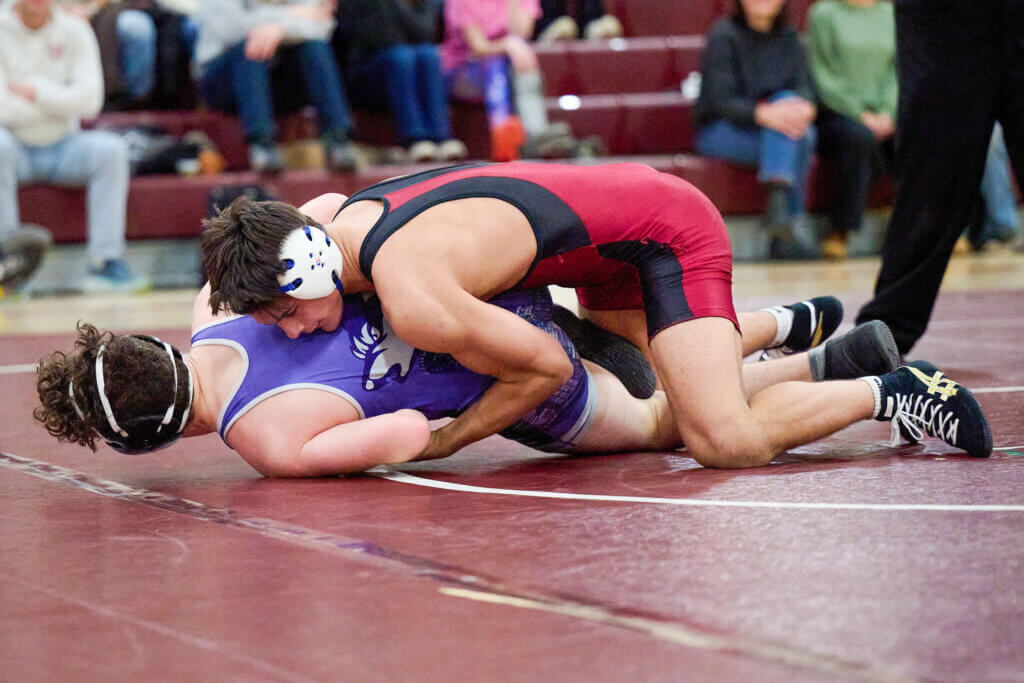 Patriots wrestler Kyle Amouzgar in action against Boston Latin. Photo by Jon Straggas