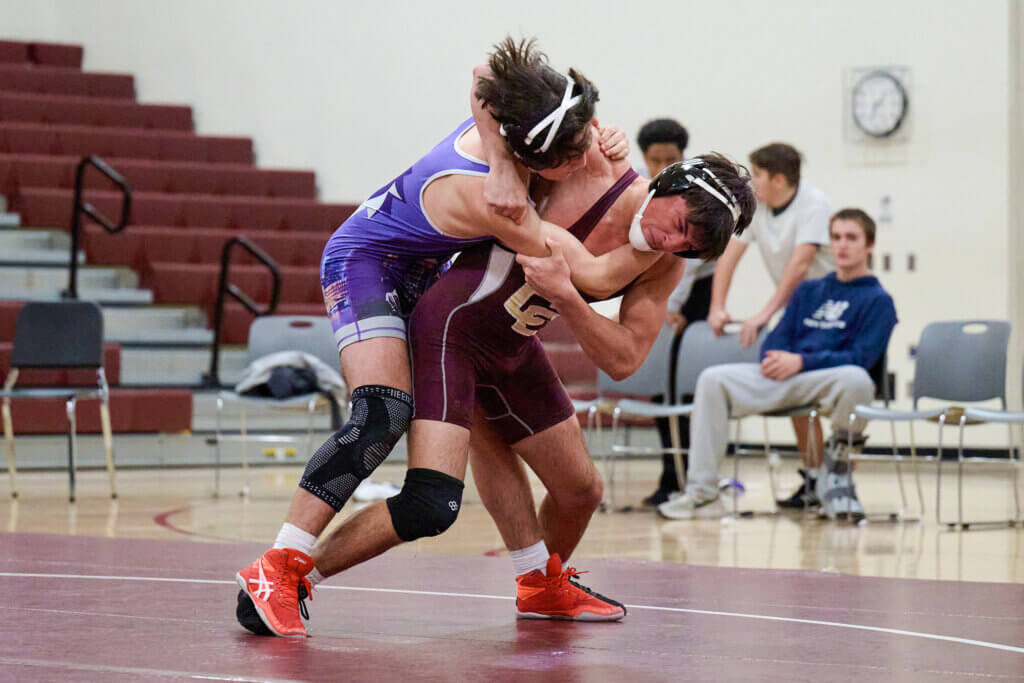 Levon Boyajian grapples for control against Boston Latin. Photo by Jon Straggas