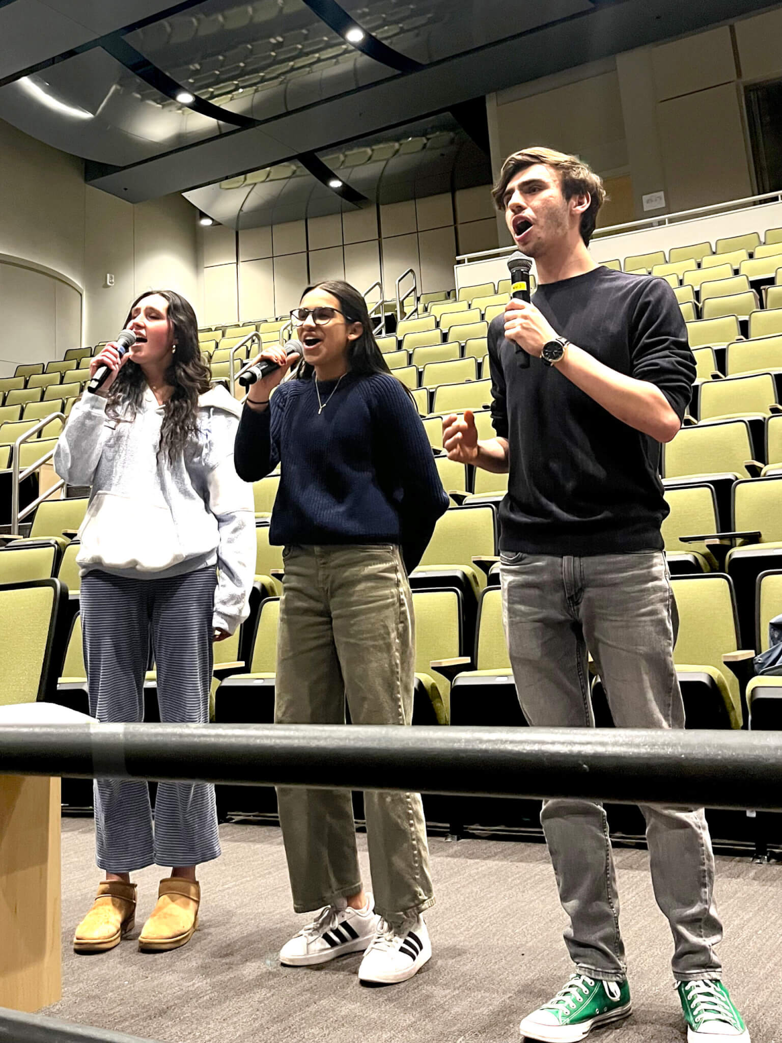 Fiona (Nicole O'Reilly, '26), Donkey (Maya Soto, '26), and Shrek (Ben Pixley, '25) sing at the sitzprobe rehearsal. Photo by Paloma Wigton, '27.