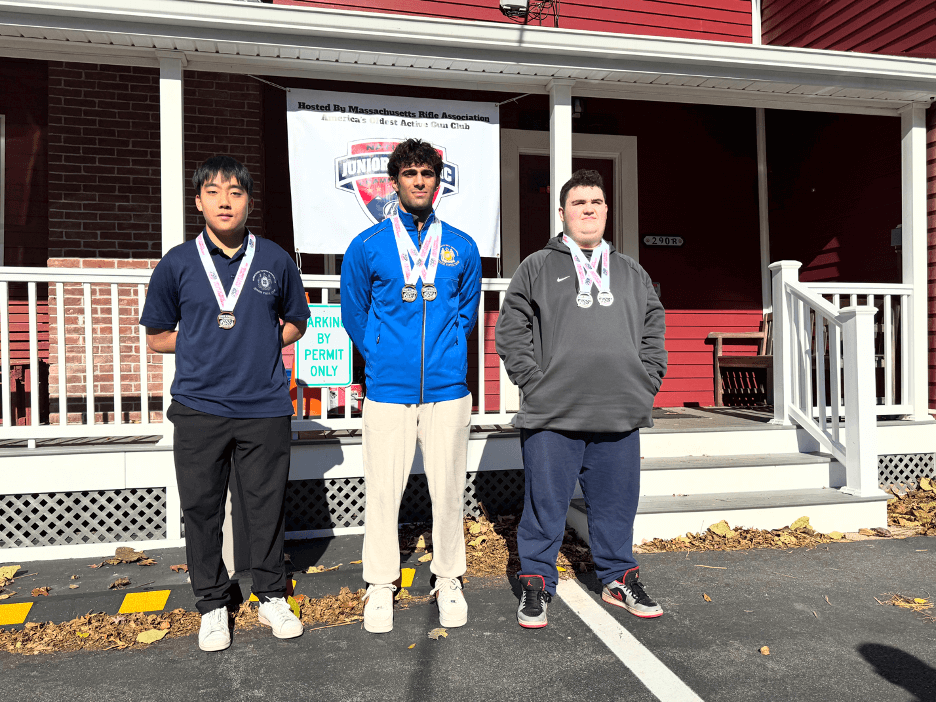 Ammar Bagasra, center, a Acton-Carlisle High School senior, earned two gold medals at the 2025-26 USA Shooting Massachusetts State Junior Olympic Qualifiers, becoming Massachusetts junior champion. Ammar captured gold in the Men’s Air Pistol and the Men’s Sport Pistol events last weekend at the Massachusetts Rifle Association in Woburn. This achievement qualifies Ammar for the USA Shooting Junior Olympics. Also pictured are silver medalist Dylan Chadsey, right, and bronze medalist Daniel Choi. Courtesy photo