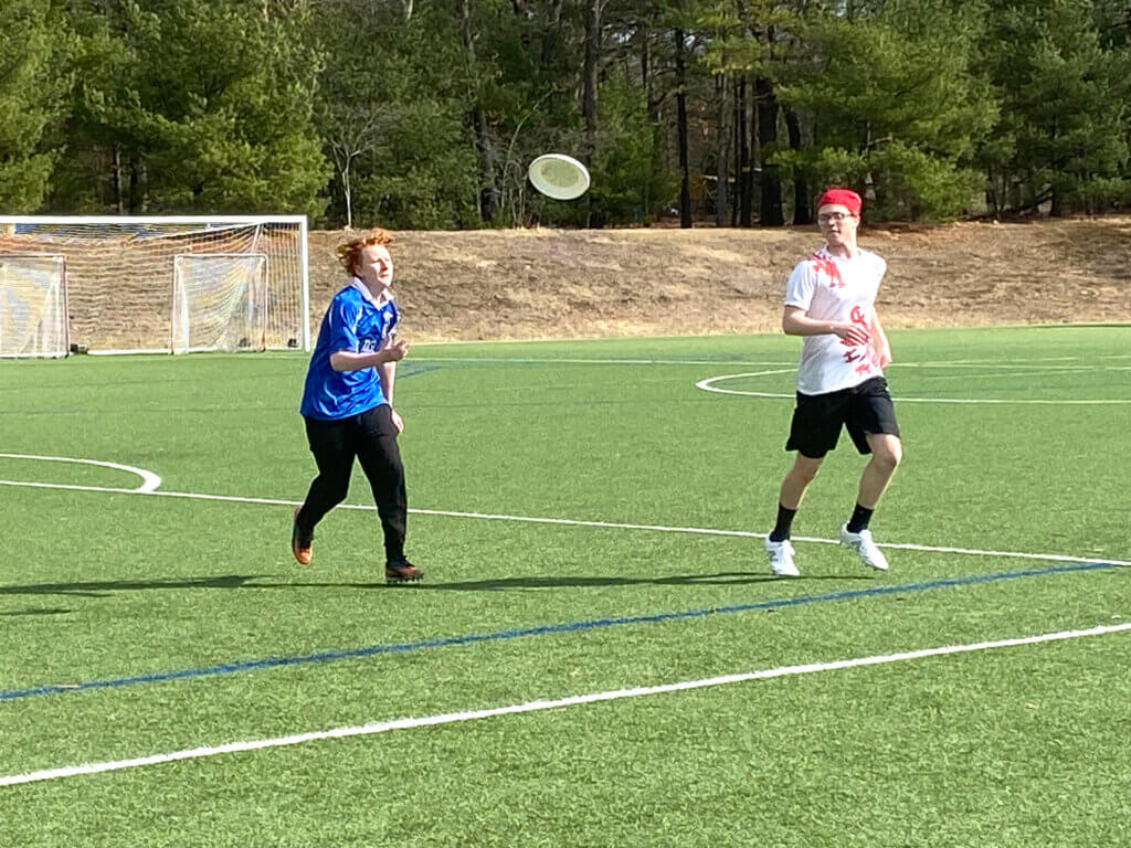 Evan Arthur (left) and Theo Carey practice handing off the Frisbee. Photo by Margaret Carroll-Bergman