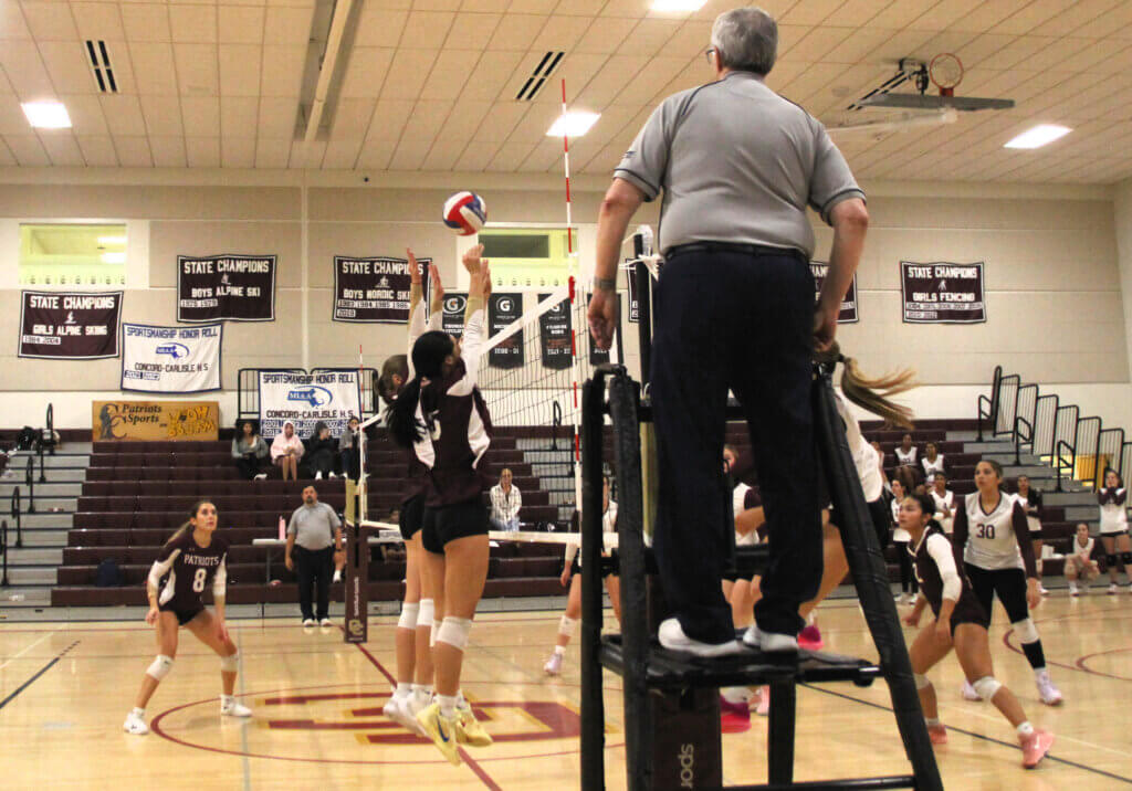 Successful double block by setter April Tang and middle hitter Olivia Scaduto in the match against Weston on September 11. Photo by Debra Antonangeli