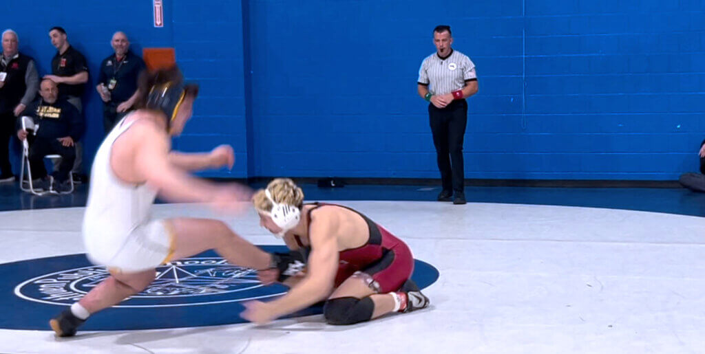 Eddie Myles goes for the ankle takedown in a dominant 15-0 win. Photo by Tamara Myles