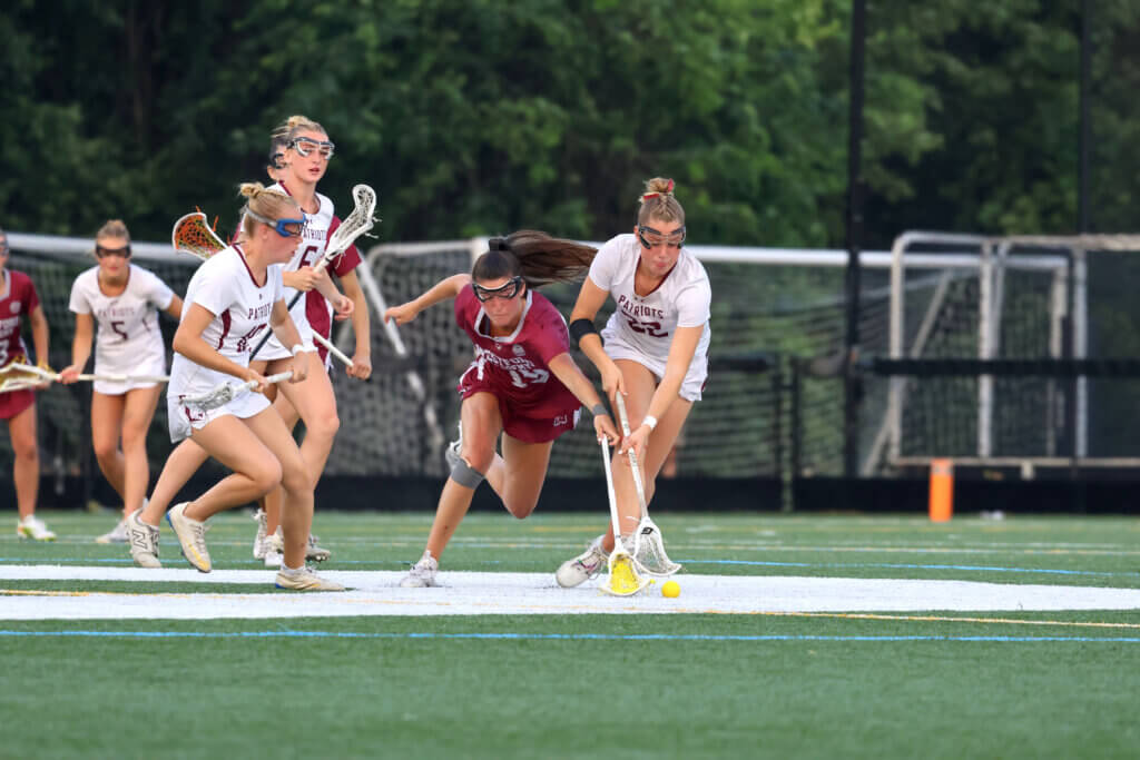 Karleigh Mutch fights Westford’s Kassidy Carmichael for the ball. Photo by Janel Apuna
