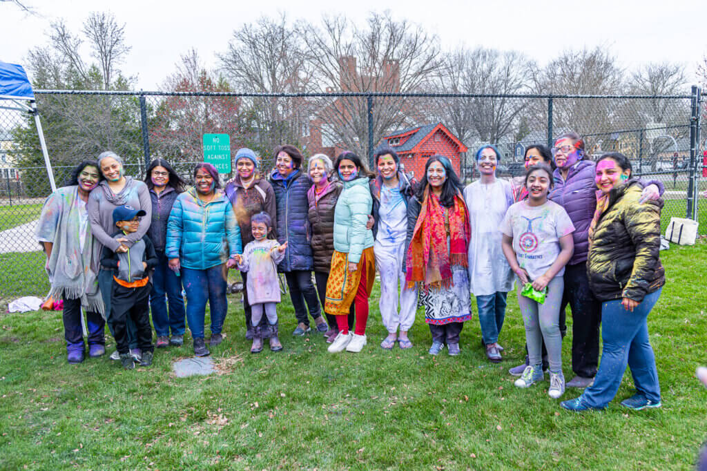 The group enjoying the Holi celebration. Photo: Stephen Beyer/The Acton Bridge