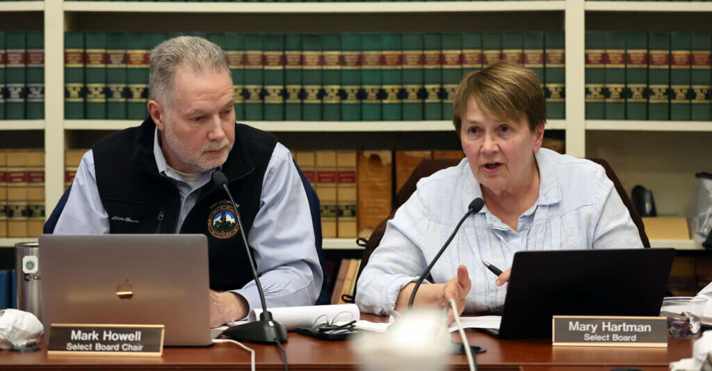 Select Board member Mary Hartman, right, speaks in favor of the Holocaust Remembrance Alliance (IHRA) definition of antisemitism as Select Board Chair Mark Howell looks on during the 2026 Town Caucus at the Town House on Tuesday, January 27, 2026. Ken McGagh/The Acton Bridge