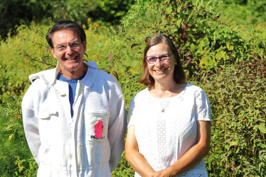 Michael Kielty and Sarah Grimwood say that beekeeping has become a beloved hobby, partially because they get to do it together. Photo: Trace Salzbrenner/The Acton Bridge