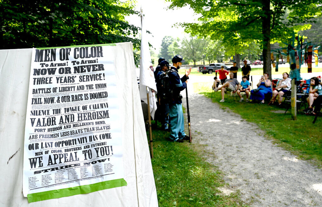 A proclamation on a tent during a living history Civil War era encampment with re-enactors of the 54th Massachusetts Volunteer Infantry, the first officially recognized Black regiment in the Union Army, at the Robbins House in Acton on Saturday, July 26, 2025. Ken McGagh/The Acton Bridge