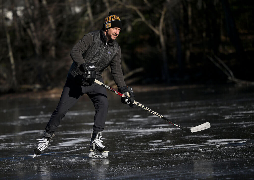 Brian McNamara of Bow, New Hampshire waits for a pass from high school friend Jack Kelleher of Acton at Nick Macone Pond on Lowell Road, Friday January 10, 2025. Ken McGagh/The Acton Bridge
