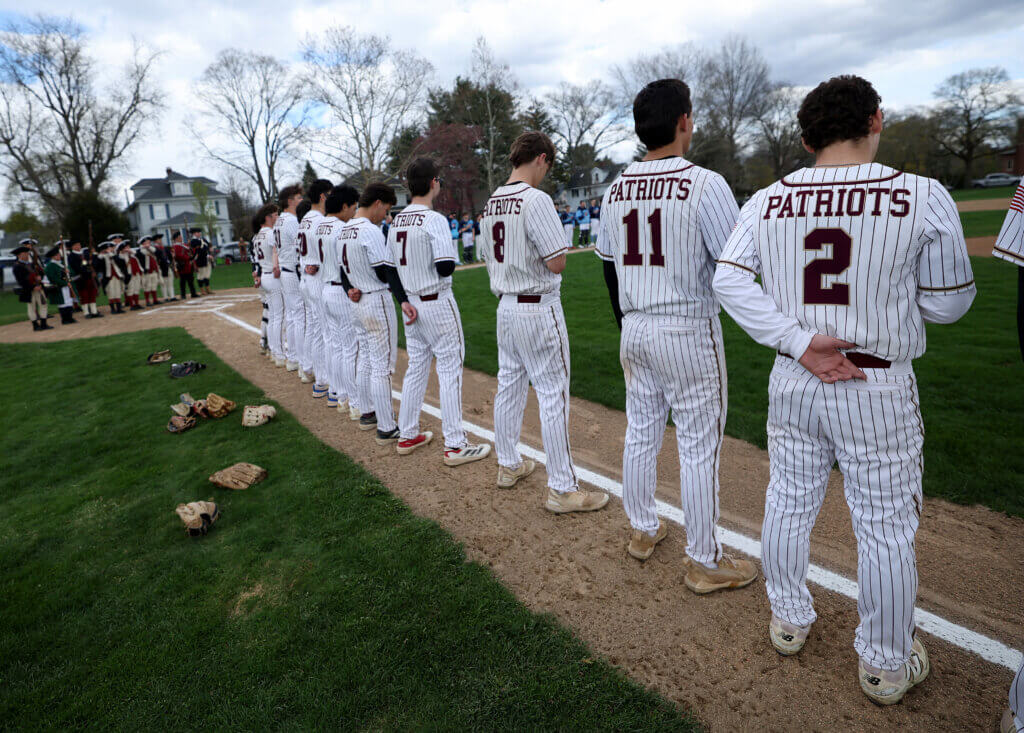 The Acton-Carlisle Patriots line up on the first base line. Photo: Ken McGagh/The Acton Bridge