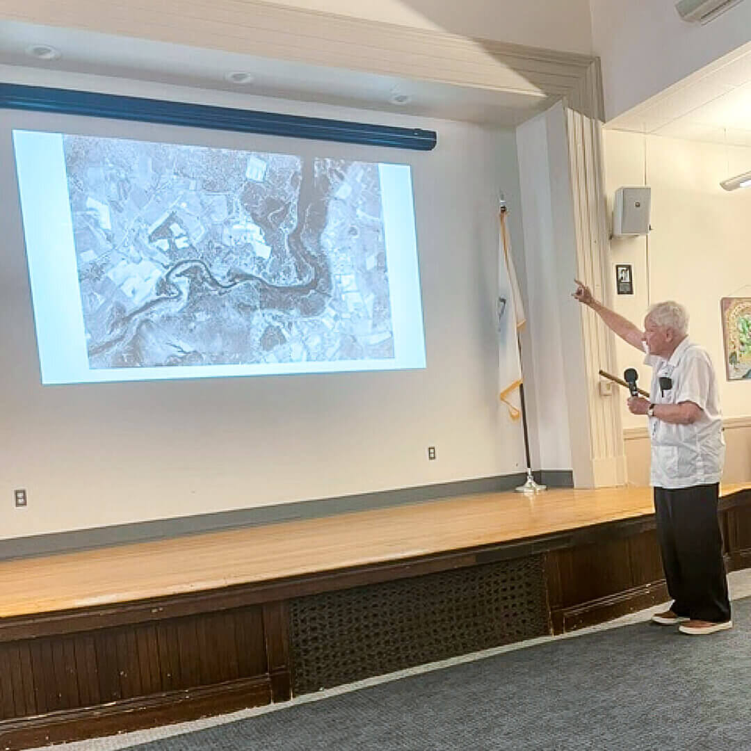 Forman, who has been dubbed “the father of landscape ecology,” makes a point with the help of aerial imagery. Photo by Fiona Stevenson