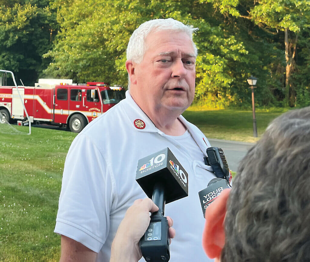 Fire Chief Thomas Judge updates reporters at the scene of a house fire last summer. Photo: Celeste Katz Marston/The Acton Bridge