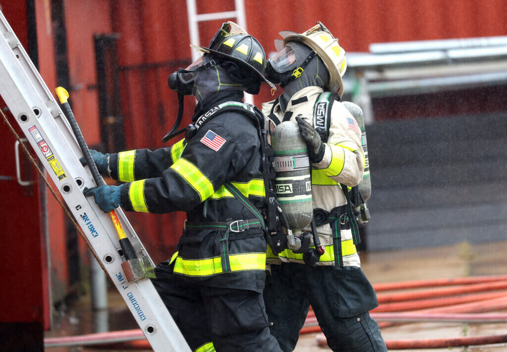 Acton Fire Department Assistant Chief Sean Murphy, right, gives instructions to a Acton firefighter during the departmenet’s “refresher” training session at the Worcester Fire Department Training Center burn building on Monday, September 27, 2026. Ken McGagh/The Acton Bridge