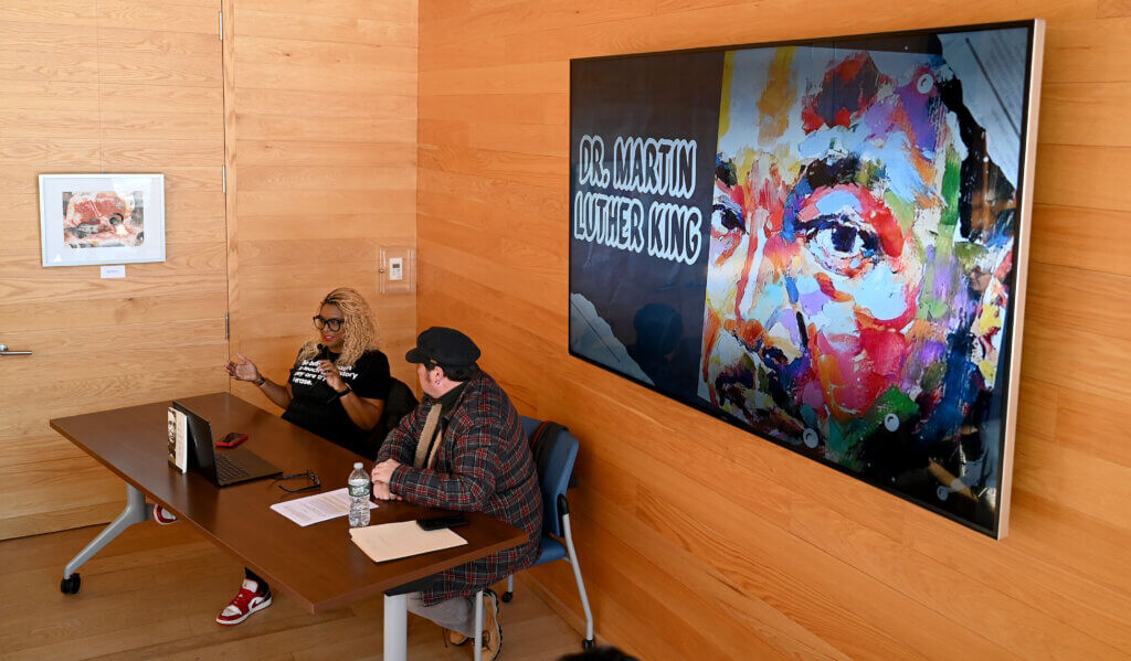 Nikki Turpin, left, president of The Robbins House, speaks as Acton historian Richard Smith look on during an interpretive program on civil disobedience in commemoration of Martin Luther King Day at the Walden Pond Visitor Center on Monday, January 20, 2025. Ken McGagh/The Acton Bridge