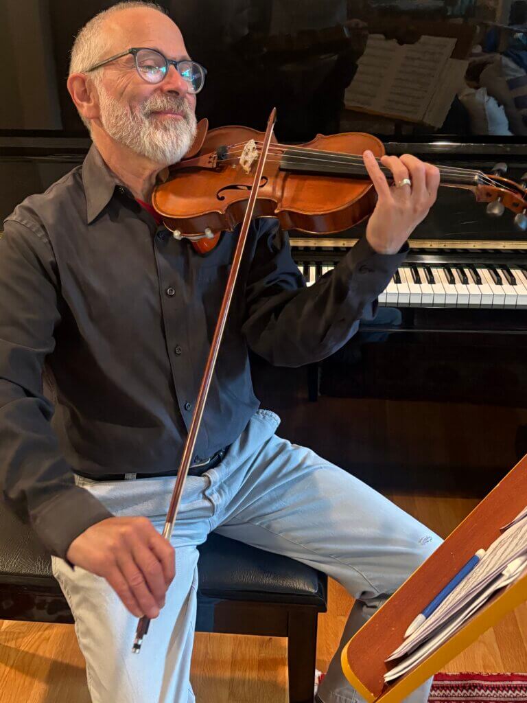 Acton resident Robert Karr plays violin. Courtesy Photo