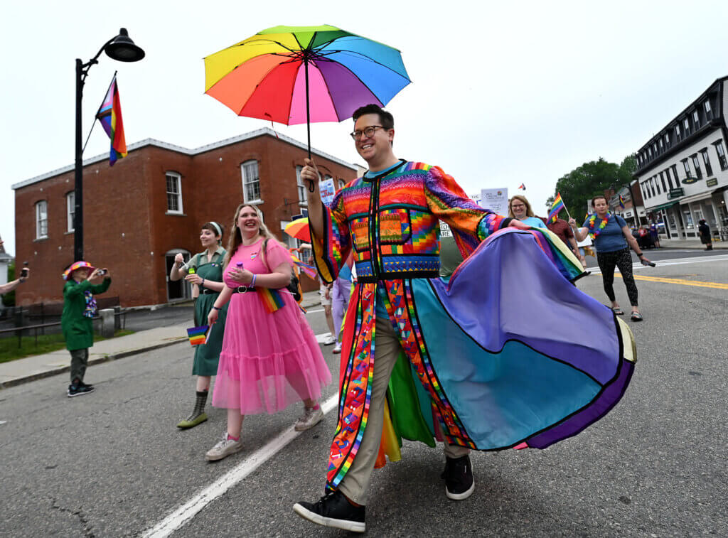 Ryan Malyar of the Acton Players participates in the march down Main Street.

