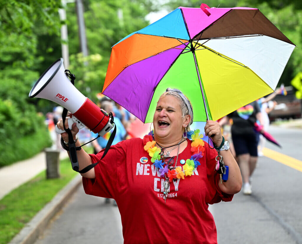 Samantha DeSuze, a Acton native who traveled from New York City to serve as ConcordPride emcee for the second time, marches from the Umbrella Arts Center to Monument Square.
