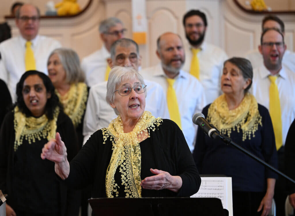 The Acton-based Music Makes Me Happy Chorus, a chorus for adults with special needs, performs  MLK Day concert “Let My People Go” at Trinitarian Congregational Church on Monday, January 20, 2025.  The chorus sang a series of spirituals and gospel songs including  “Go Down Moses,” “We Shall Overcome,” “Swing Low, Sweet Chariot,”  “Michael, Row the Boat Ashore,” “Wade in the Water,” “This Little Light of Mine,” and “When the Saints Go Marching In.” Acton historian and Henry David Thoreau interpreter  Richard Smith also gave a presentation  during the concert.   Ken McGagh/The Acton Bridge