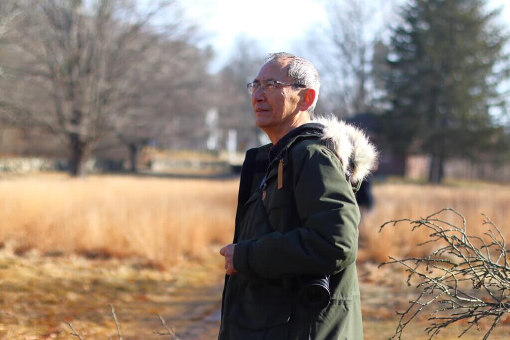 Peter Lee, chair of the Heywood Meadow Stewardship Committee, watches as the apple trees are pruned on January 15. Photo: Trace Salzbrenner/The Acton Bridge