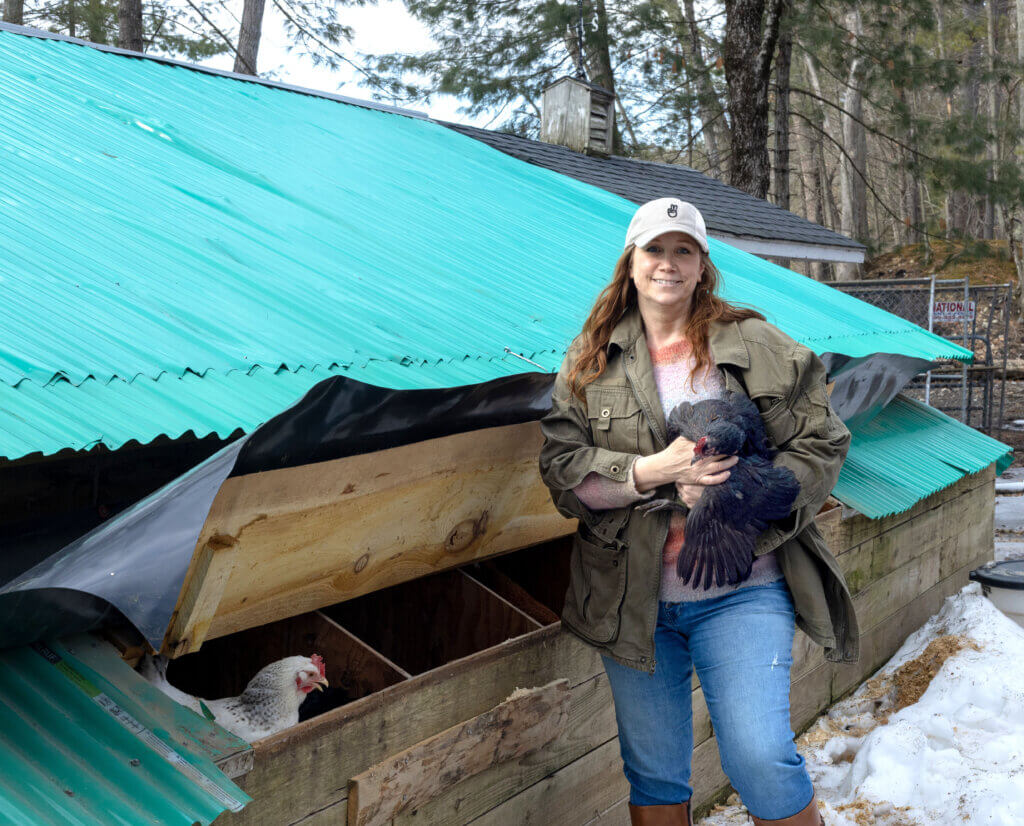 Michelle Poor holding one of her many chickens. Photo by Carson Paradis
