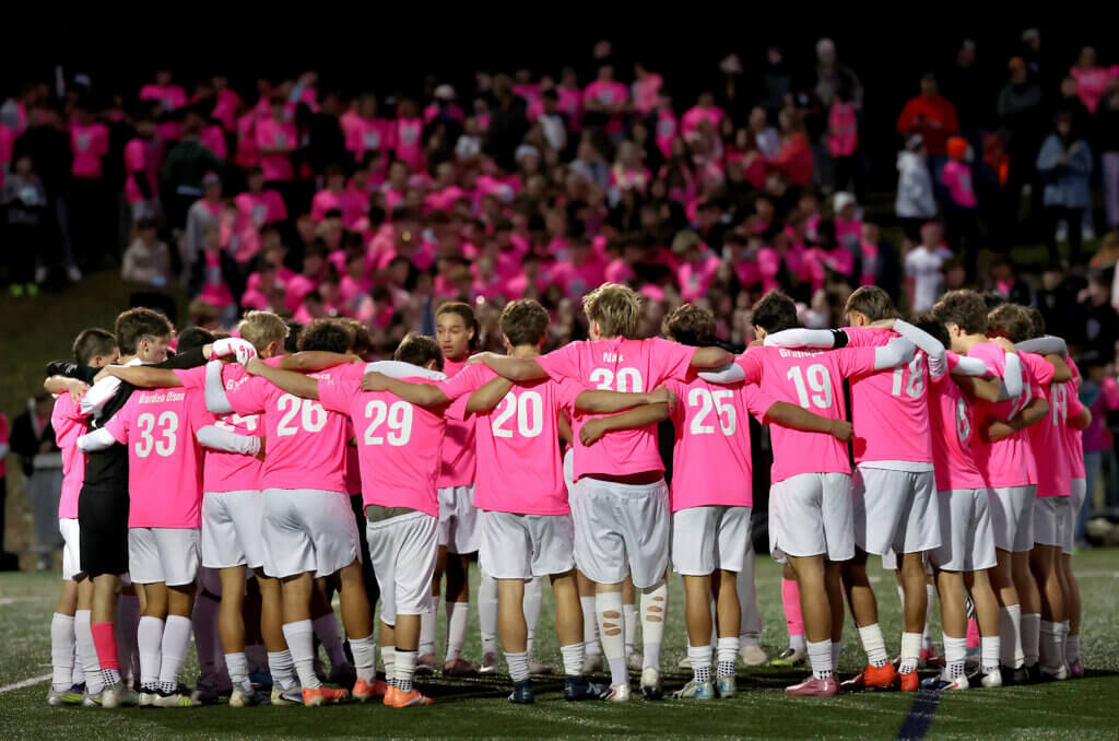 The team amid a sea of Kicks-shirted fans.