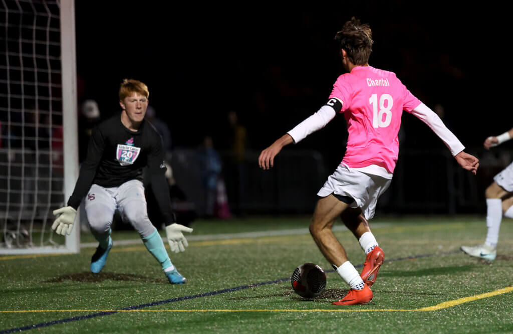Acton-Carlisle’s Max Hepworth (No. 18) scores a first-half goal.