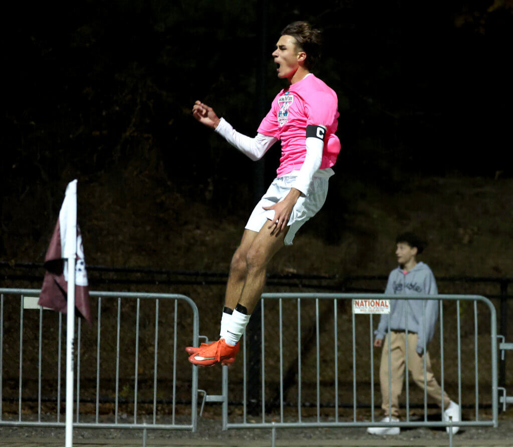 Acton-Carlisle’s Max Hepworth soars after he scores.