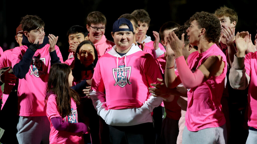 CCHS sophomore Chase Gillick, center, who is battling leukemia, is recognized by family, friends and classmates at halftime.