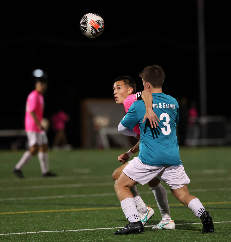 Liam Nielsen, left, battles Lincoln-Sudbury’s Ryan Spector.